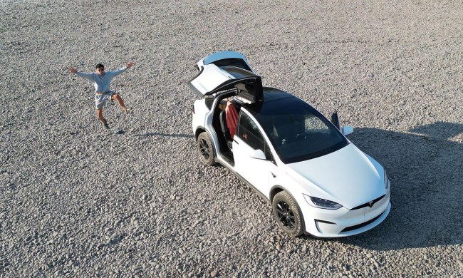Aerial shot of YouTuber Everyday Sandro outside his Tesla Model X.